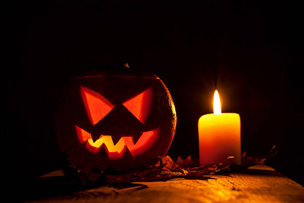 istock Halloween pumpkin and candle 611865290