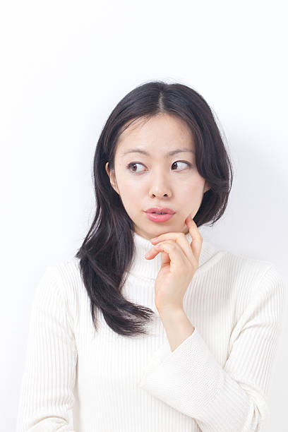 istock Japanese woman thinking 611865618