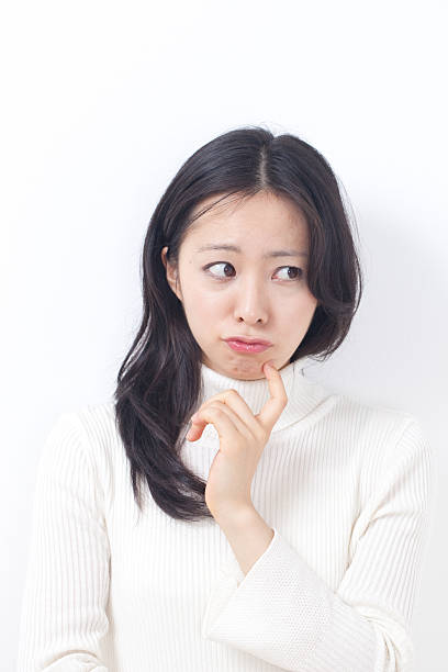 istock Japanese woman thinking 611865716