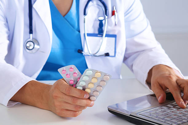 istock doctor in the Office makes an entry 611867394