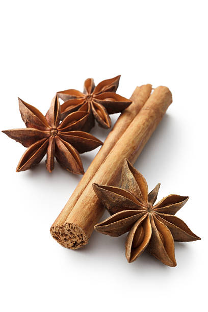 istock Dried Herbs and Spices: Cinnamon and Anise Isolated on White 611867866