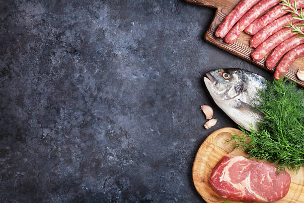 istock Sausages, fish and meat cooking 611868424