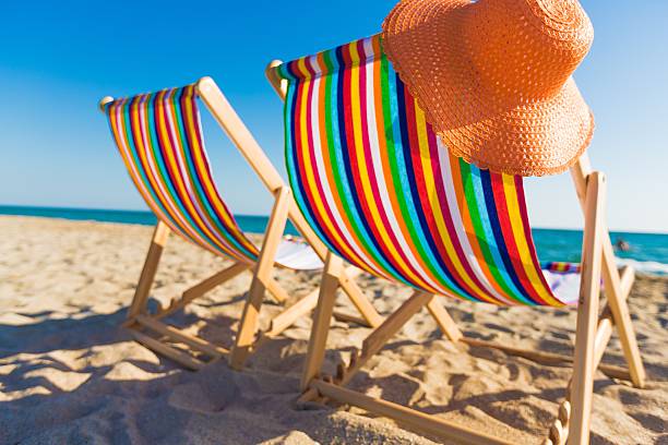 Deck Beach Chairs on the Coast deck chair stock pictures, royalty-free photos & images