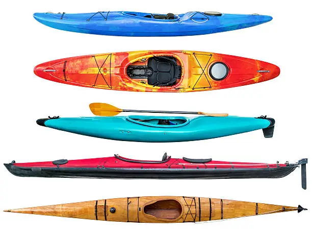 a collection of sea and whitewater kayaks isolated on white