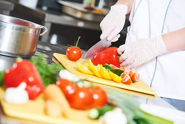 istock cook chef hand preparing salad food in kitchen 611874804