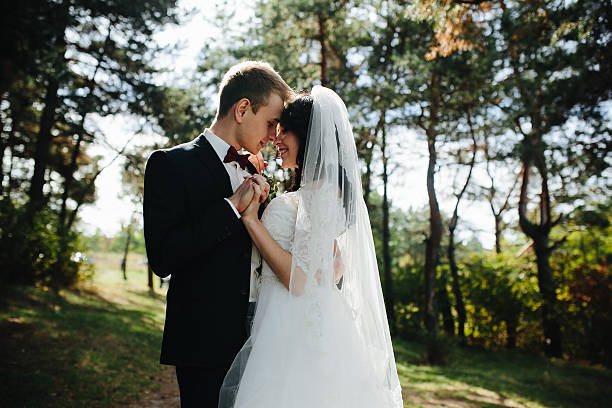 istock Beautiful wedding couple posing 611874906