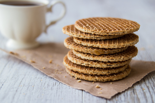 Stroopwafel  is a waffle made from two thin layers of baked dough with a caramel-like syrup filling in the middle.