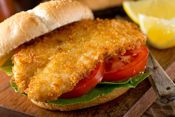 fischburger  - cod fillet fried prepared fish stock-fotos und bilder