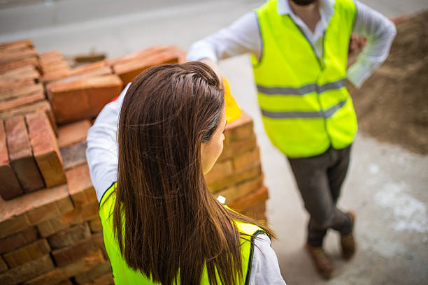 istock Young woman architect resting on the job. 611876760