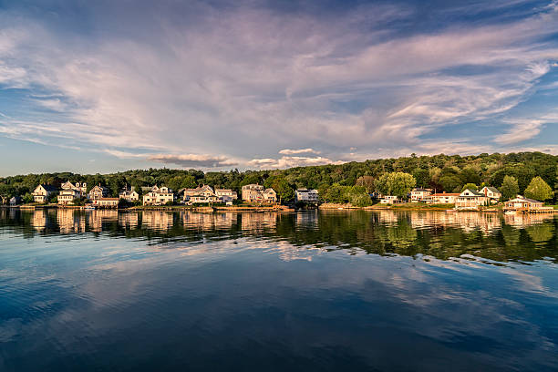 istock Maine harbor with waterfront village. 611877464