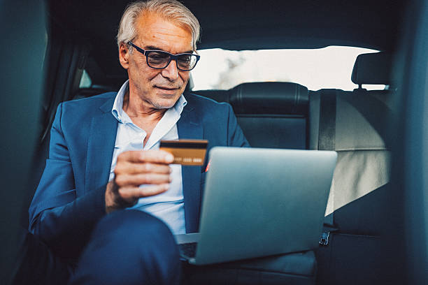 istock Mature man shopping with credit card 611877664