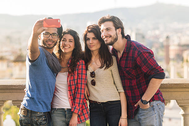 istock Group of fiends taking a selfie in Barcelona. 611878512