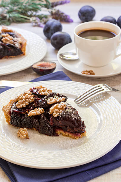 istock Piece of plum cake with coffee. 611879724