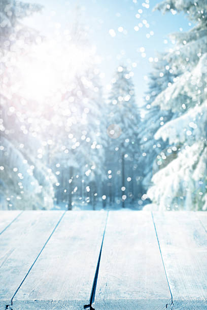 Snowy winter background with empty wooden planks