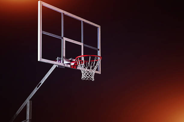 istock Basketball houp on black arena background 611882482