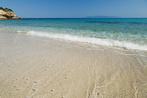 Sandy beach with crystal clear water of Agios Thomas beach on Kefalonia island in Greece.