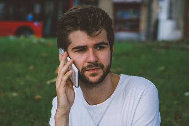 istock Young man speaking in the phone 611883592