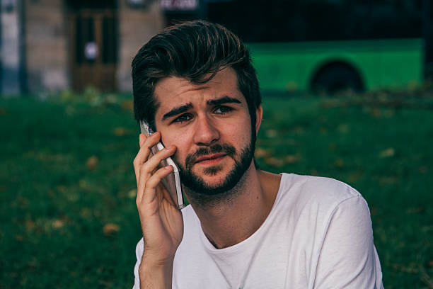 istock Young man speaking in the phone 611883896