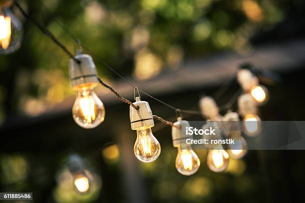 Outdoor String Lights Hanging On A Line In Backyard Stock Photo - Download Image Now