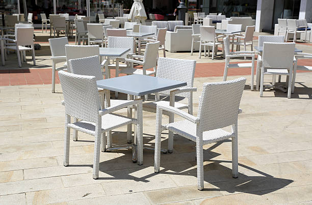 istock able and chairs in street caffe 611886434