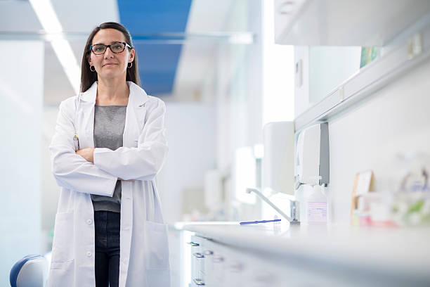 istock Woman dentist's portrait looking at camera. 611886730