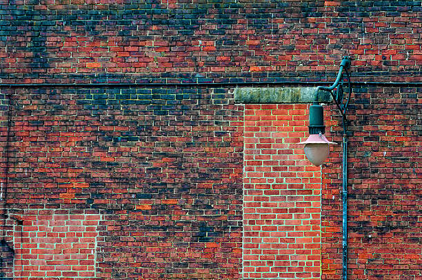 istock Brick Wall and street light poost 611887650