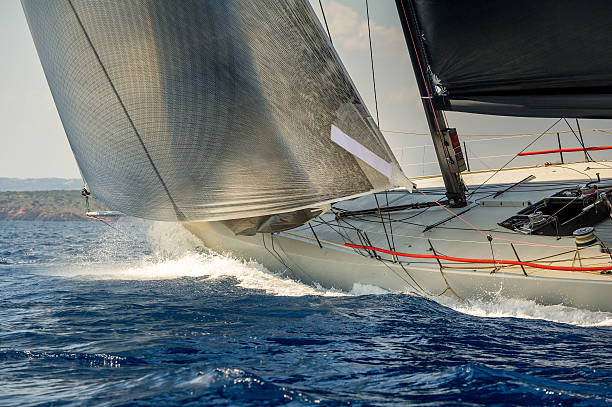 istock Racing sailing yacht going fast in the Mediterranean sea 611887700