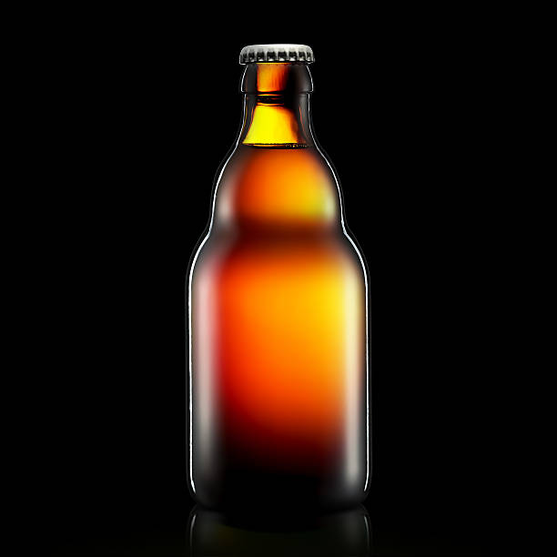istock Bottle of beer or cider isolated on black background 611890550