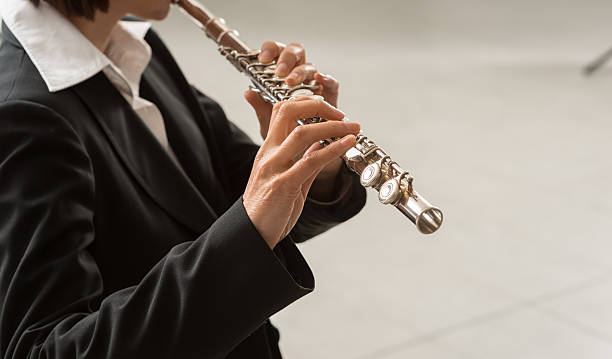 istock Woman playing transverse flute 611890566