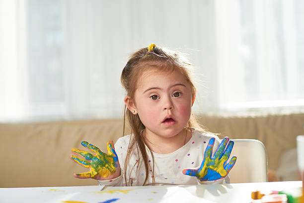 istock Cute girl with painted hands 611893160