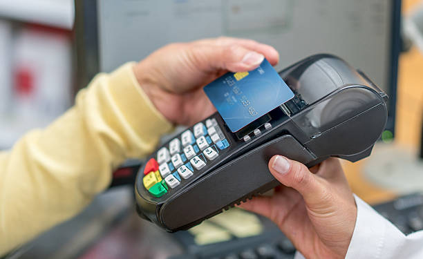 istock Woman making a contactless payment 611893466