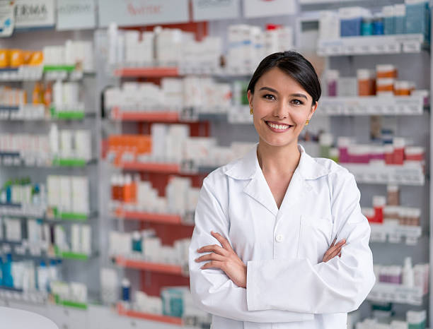 istock Pharmacist working at the drugstore 611893544