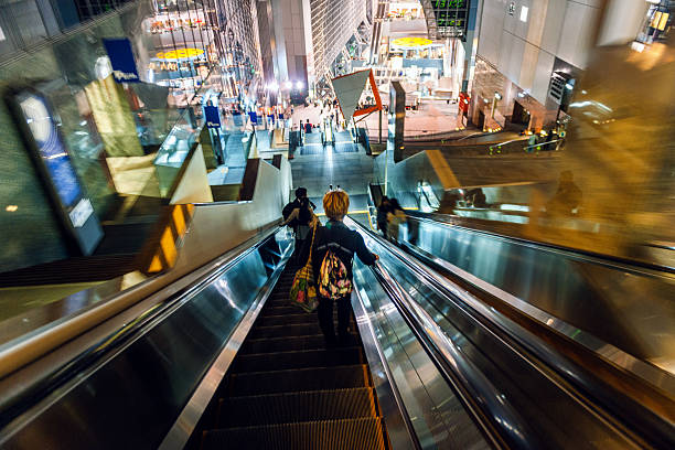 Motion blurred travellers walking in modern railway station in Kyoto,Japan,NikonD3x