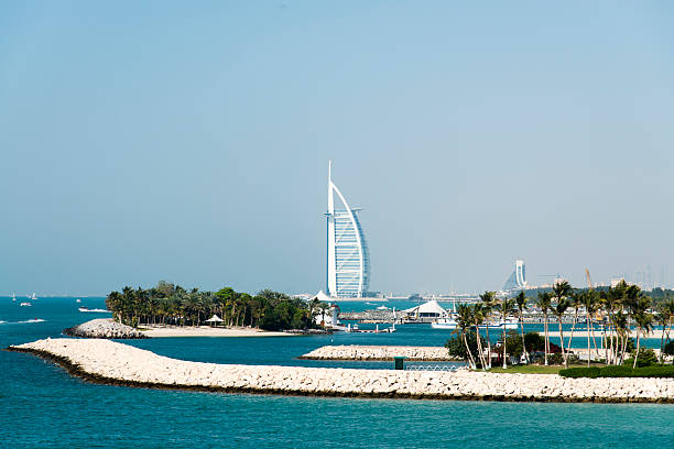 Dubai, United Arab Emirates - February 17, 2010: View of Burj Al Arab hotel from the Jumeirah beach. Burj Al Arab is one of the Dubai landmark, and one of the world's most luxurious hotels with 7 stars