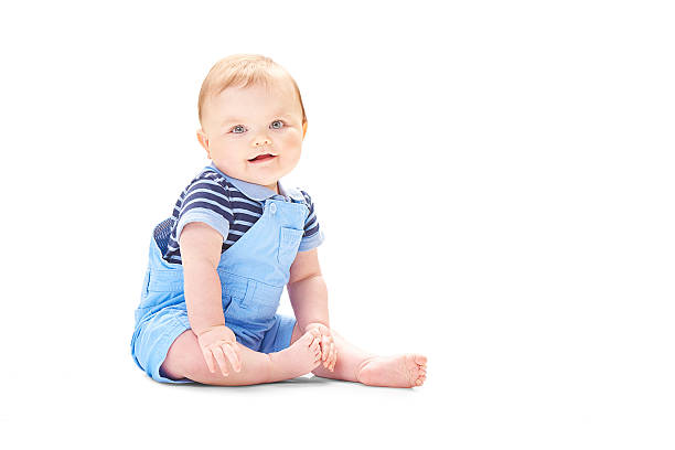 istock Baby boy smiling to camera isolated on white 611897134