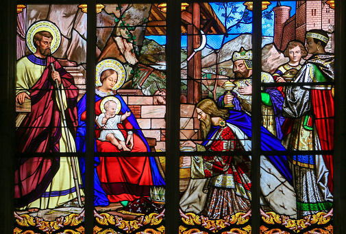 Tours, France - August 14, 2014: Stained glass window depicting the Epiphany, the Visit of the Three Kings in Bethlehem, in the Cathedral of Tours, France.