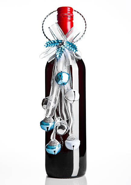 istock Bottle of red wine with christmas decoration blue 611897900