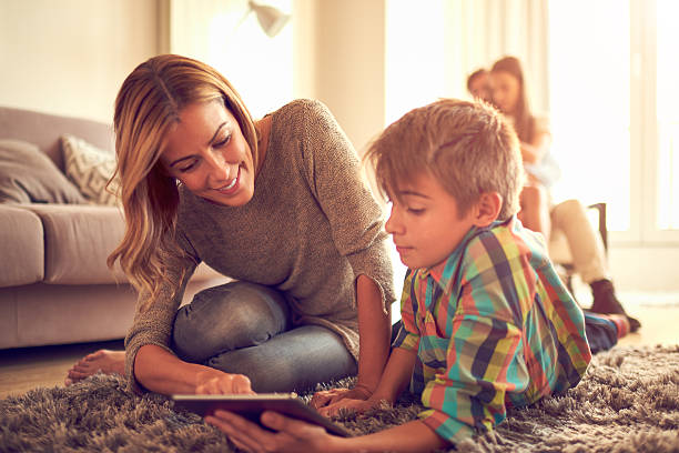 istock Mother and son with digital tablet 611898962