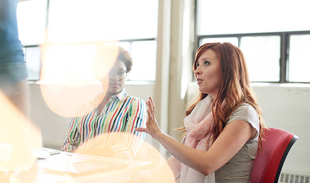 istock Unposed group of adult student in an open concept  class 611899368