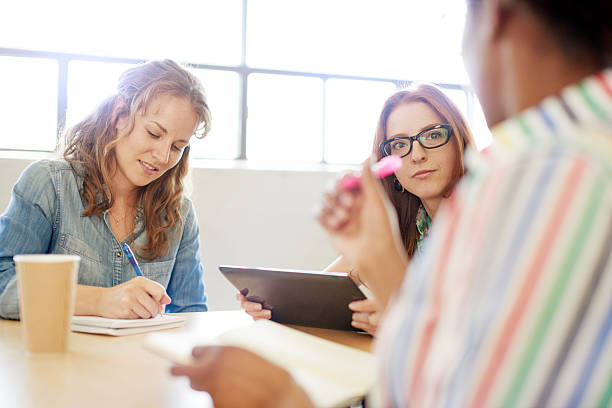 istock Unposed group of creative business people in an open concept 611899428