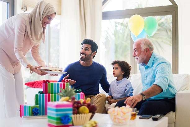 istock Three generation family celebrating a birthday in Dubai. 611899868