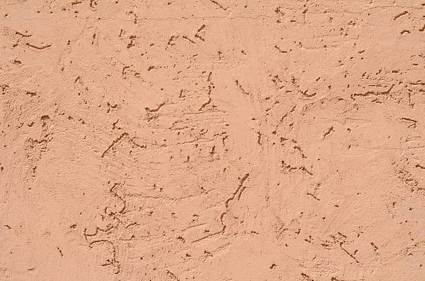 istock Background of a brown stucco coated and painted exterior 611900170