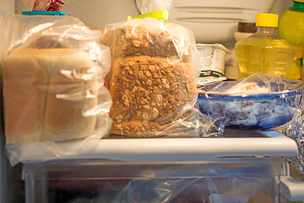 Inside a Home Fridge with bread  and other articles stock photo
