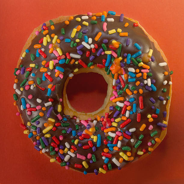 istock Chocolate Frosted Sprinkled Donut - Square Crop 611902236