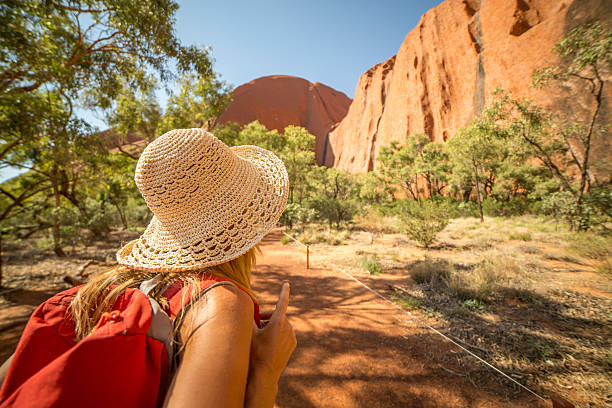 Woman hiking in Australia Young woman in Australia hiking looks at the spectacular landscape. alice springs photos stock pictures, royalty-free photos & images