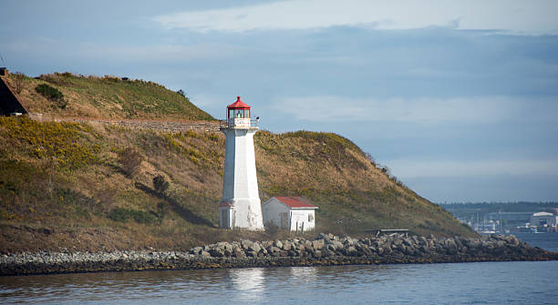 istock Georges Island in Halifax harbor with lighthouse at sunset 611902874