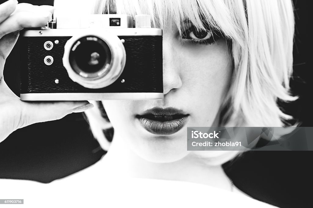 White Beauty capture with analog camera Beautiful girl filming with analog camera Fashion Stock Photo