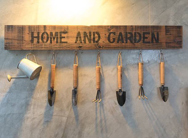 istock garden tool and watering can hang on wall 611985268