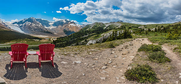 istock Panorama Pair of Red Chairs on the Trail 611985906