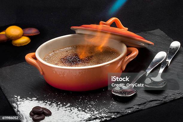 Flaming Creme Brulee Stock Photo - Download Image Now - Creme Brulee, Flambe, Cooking
